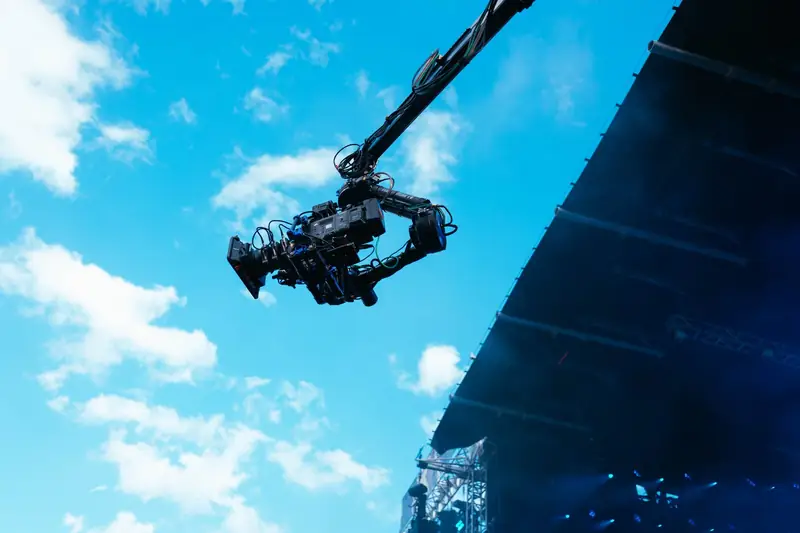 Our jib arm against the sky at Don&rsquo;t Fall in Love Fest, with the stage screen below.